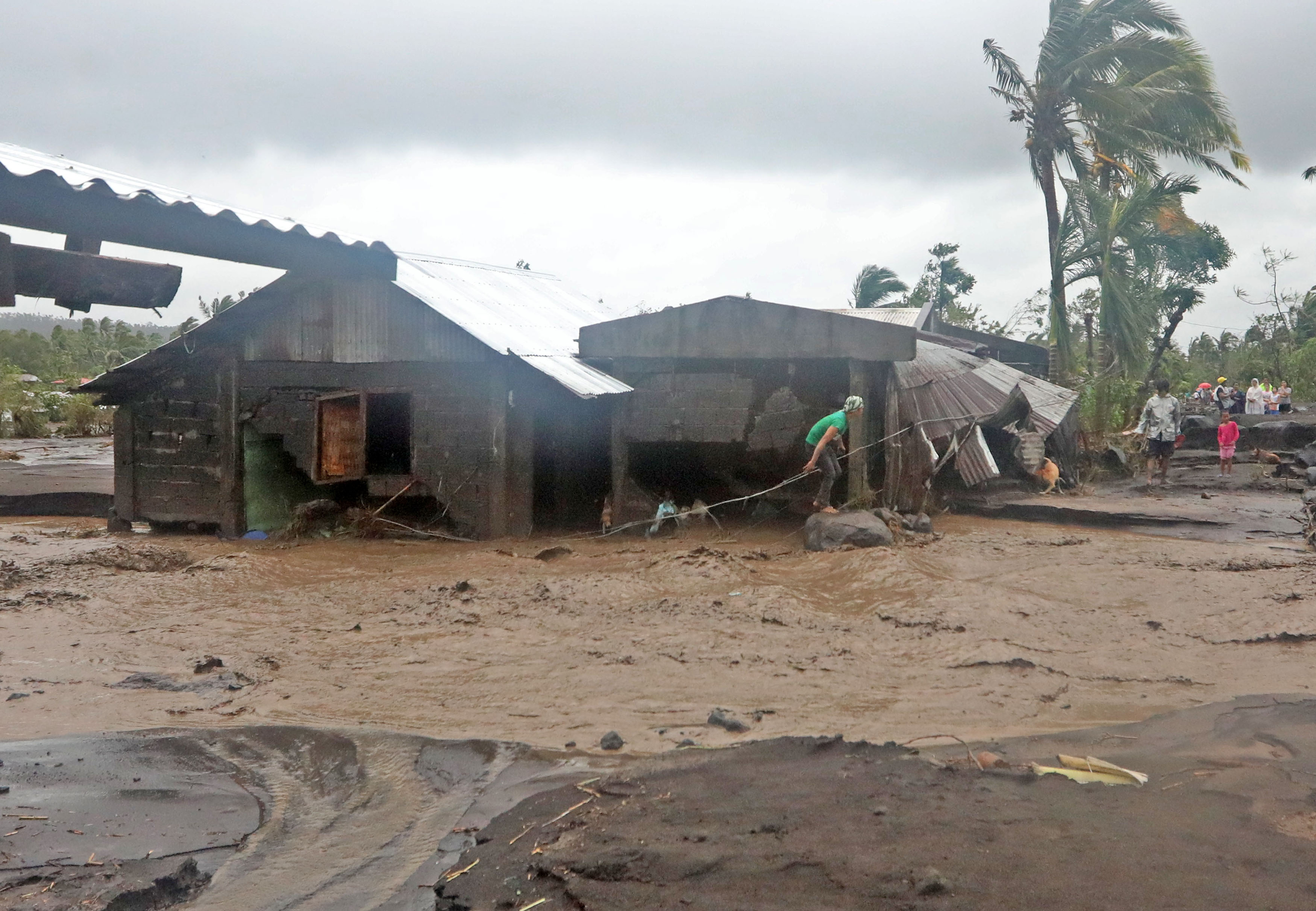 Houses at barangay San Francisco in Guinobatan Albay were covered with Lahar after Typhoon Rolly (The Philippine Star)