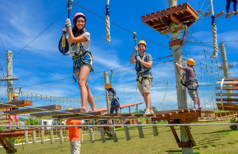 Enjoy thrilling activities like this aerial walk at SandBox.
