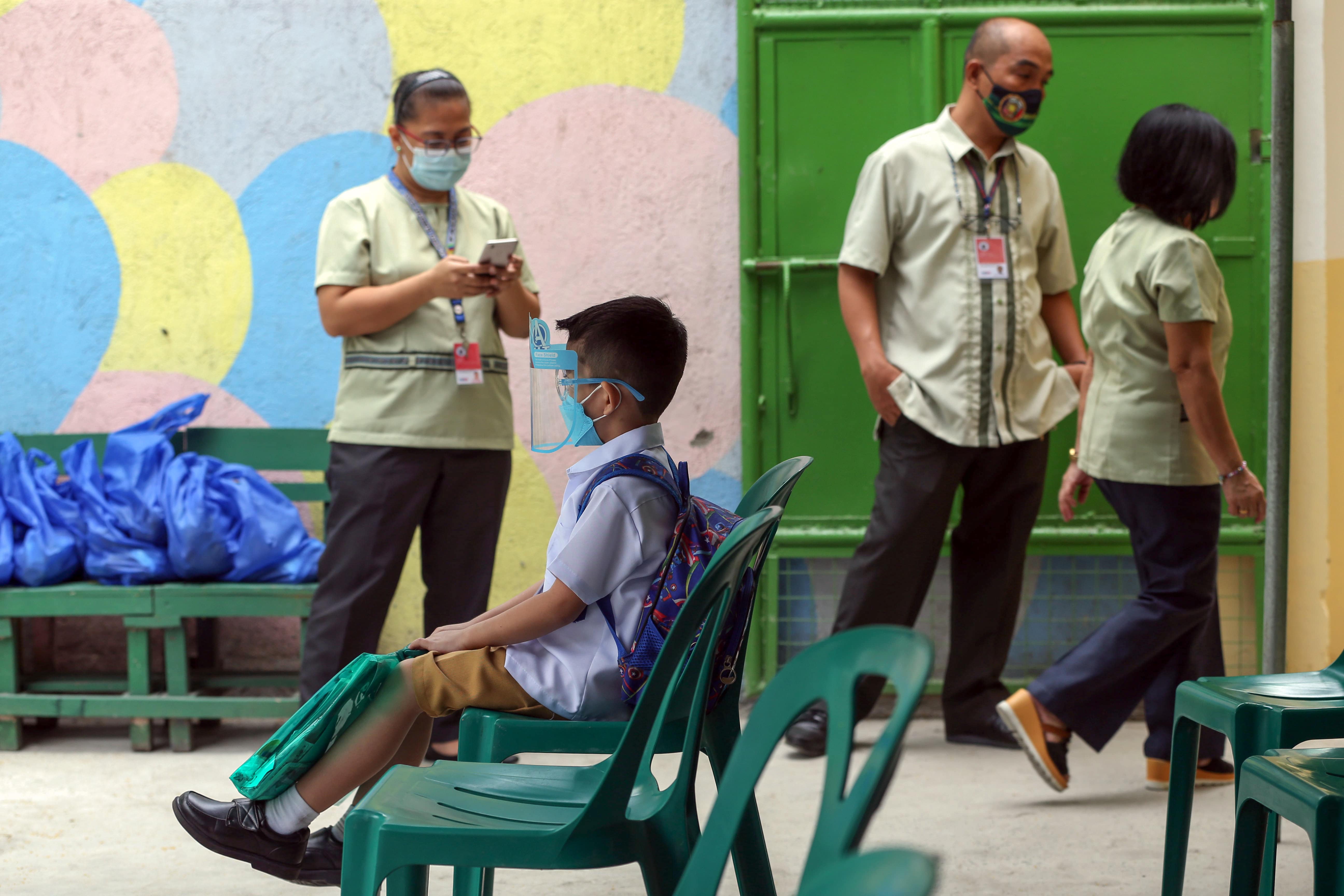 Students attend their first day of limited face-to-face classes at the La Huerta Elementary School in Parañaque City. (KJ Rosales/The Philippine Star)